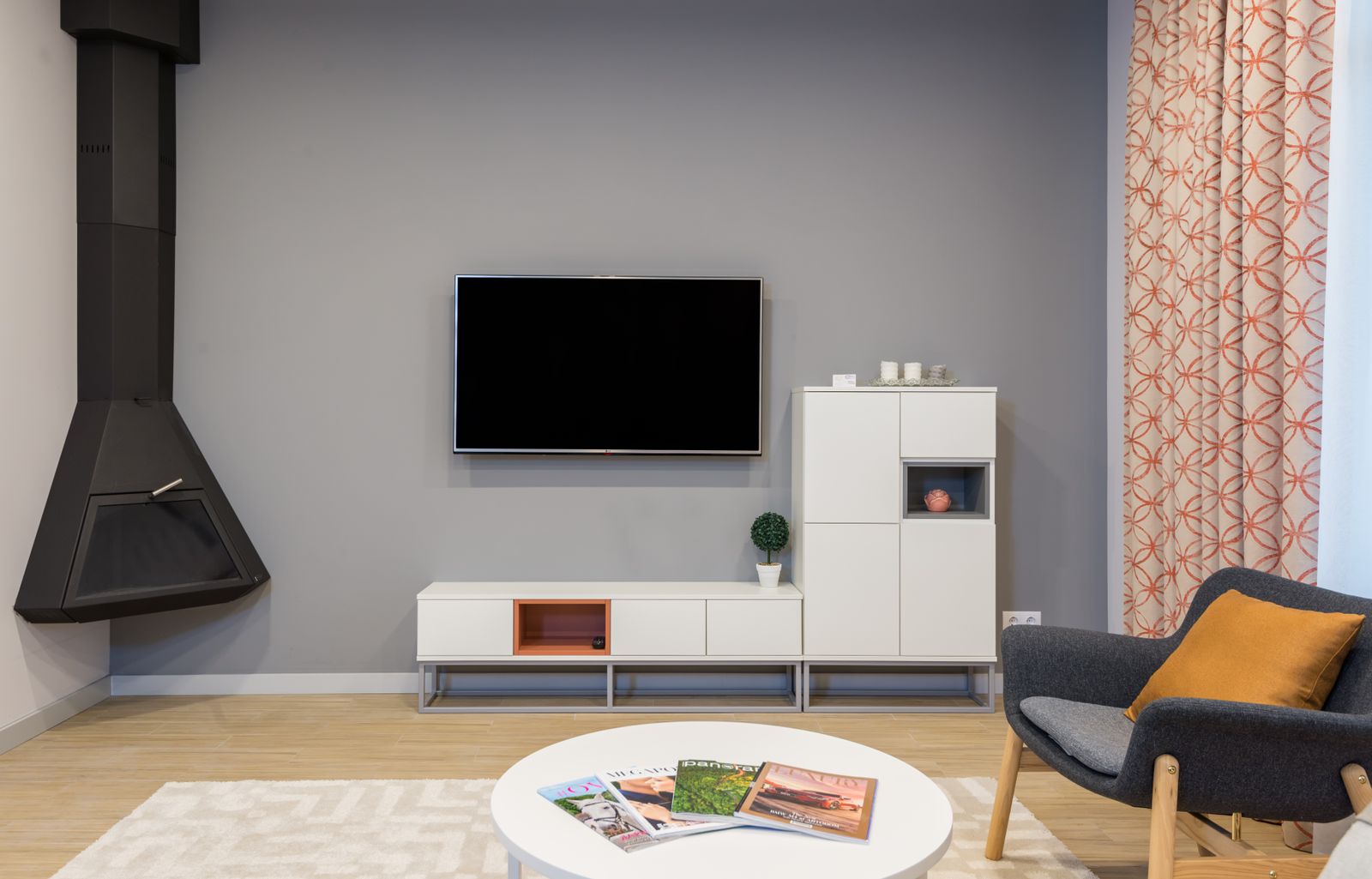 Stock inspiration: a contemporary television wall with white cabinets and a separate fireplace.