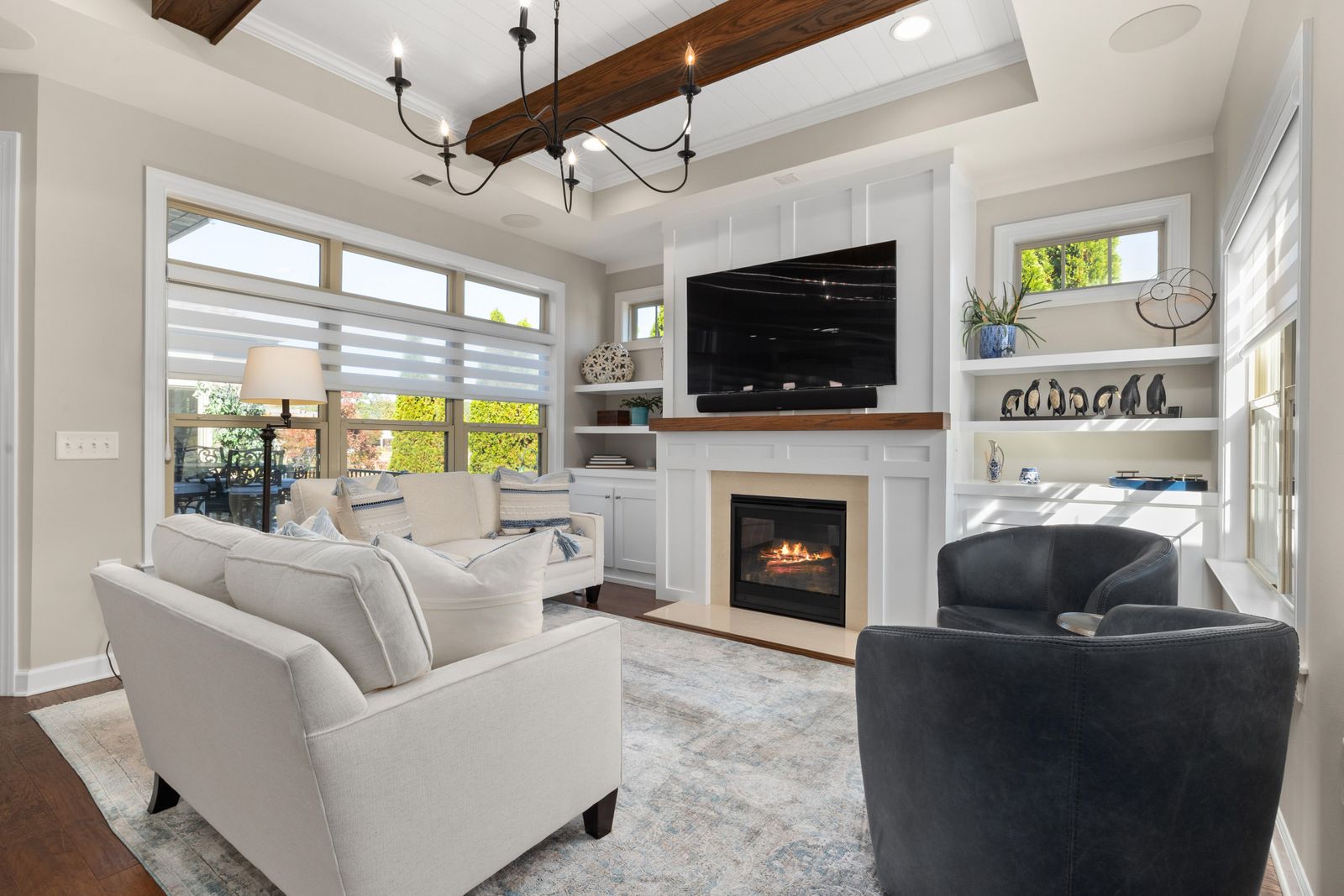 Stock inspiration: a television and fireplace framed by shelves and base cabinets.