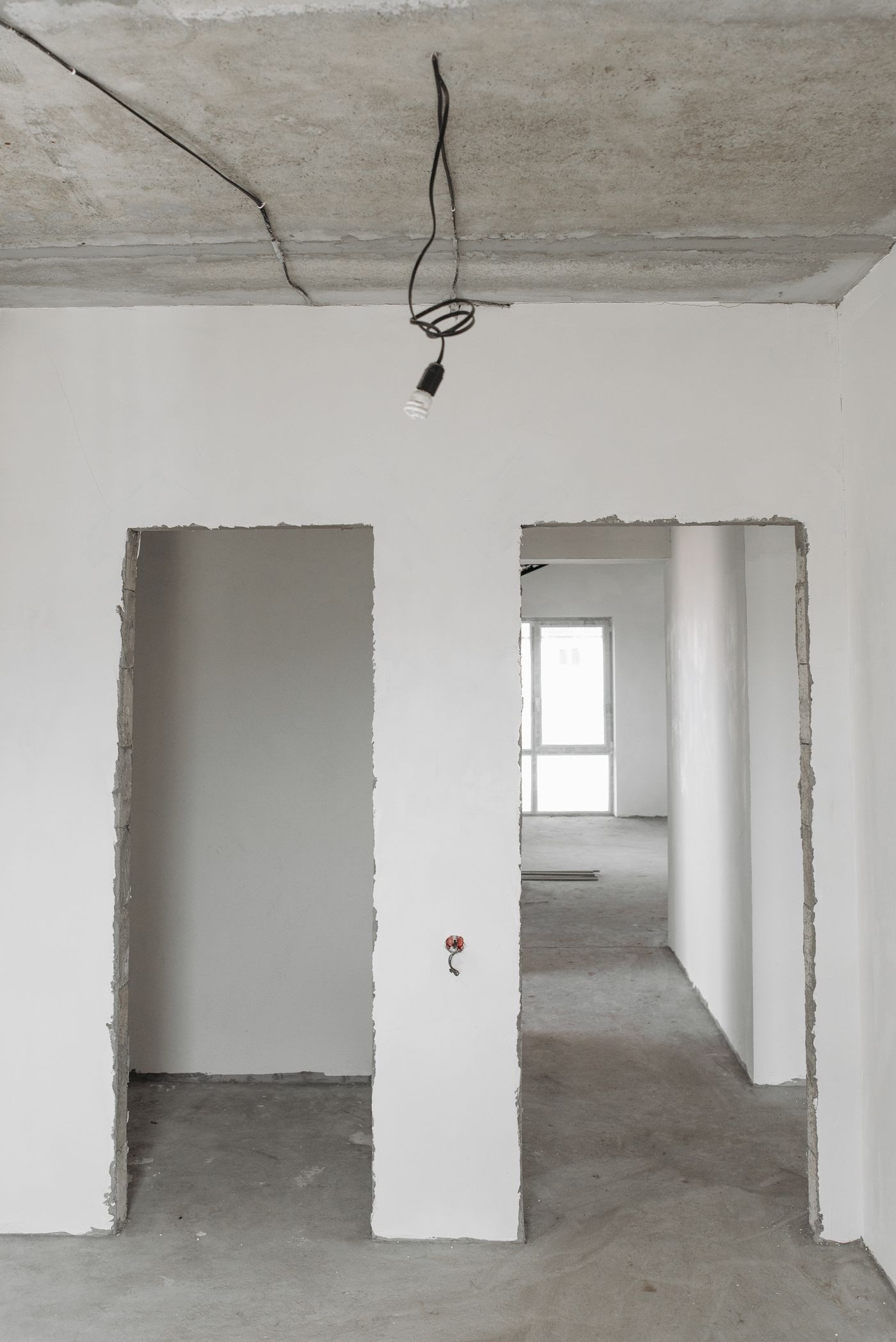 Stock inspiration: door openings and unfinished surfaces in a room under construction.